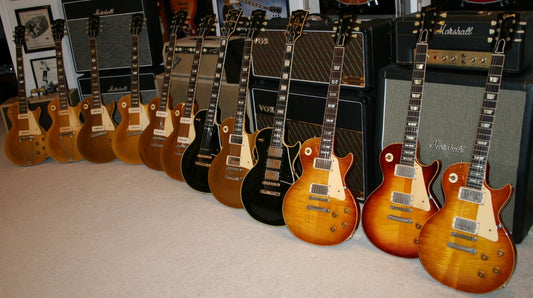 12 Vintage Les Pauls on display in one room